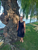 Photo of Sandra Ruch in front of a tree